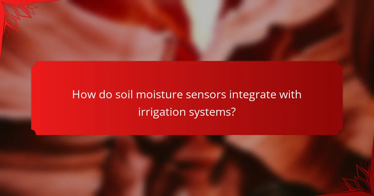 How do soil moisture sensors integrate with irrigation systems?